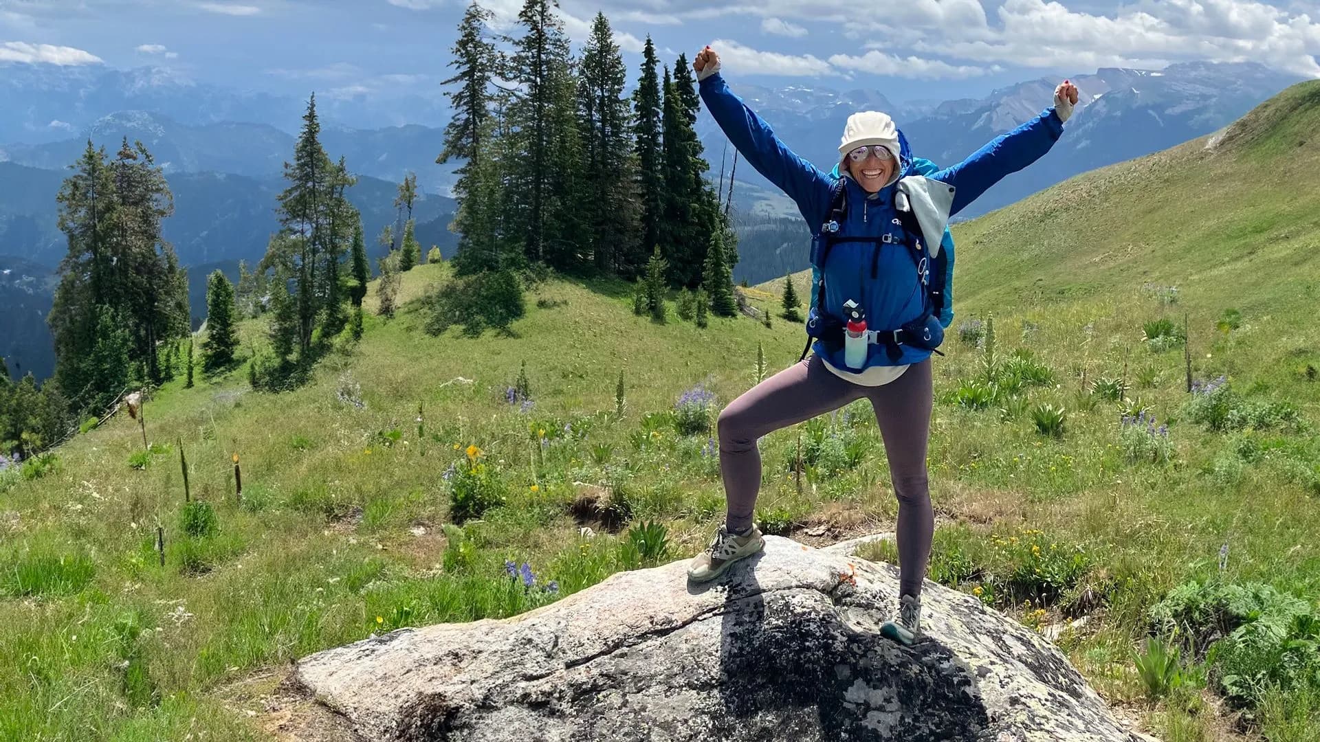 Amy Mann celebrating on a summit