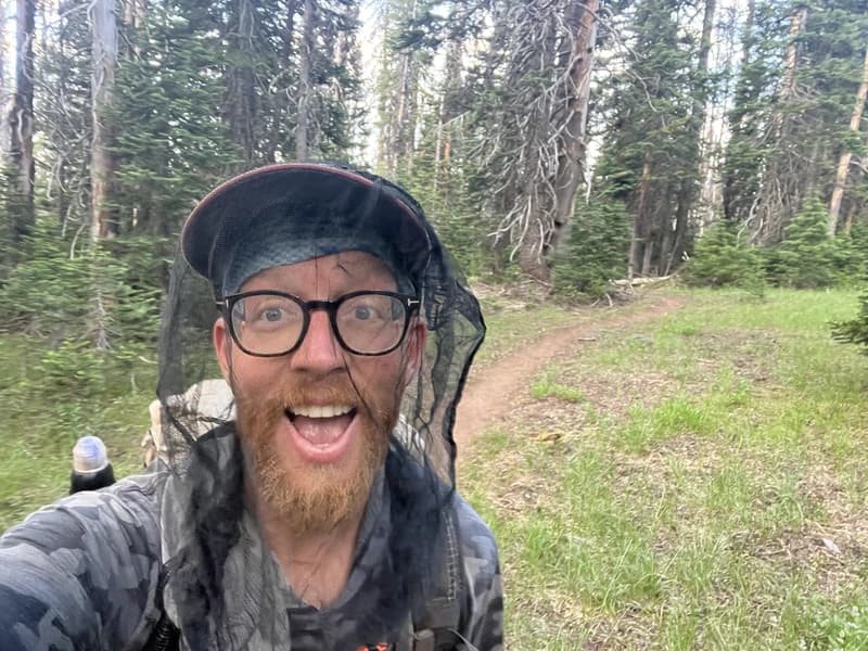 austin hiking with a bug net on
