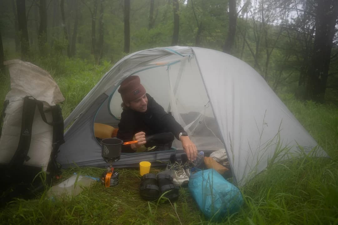 Caleb Adcock at a house on trail