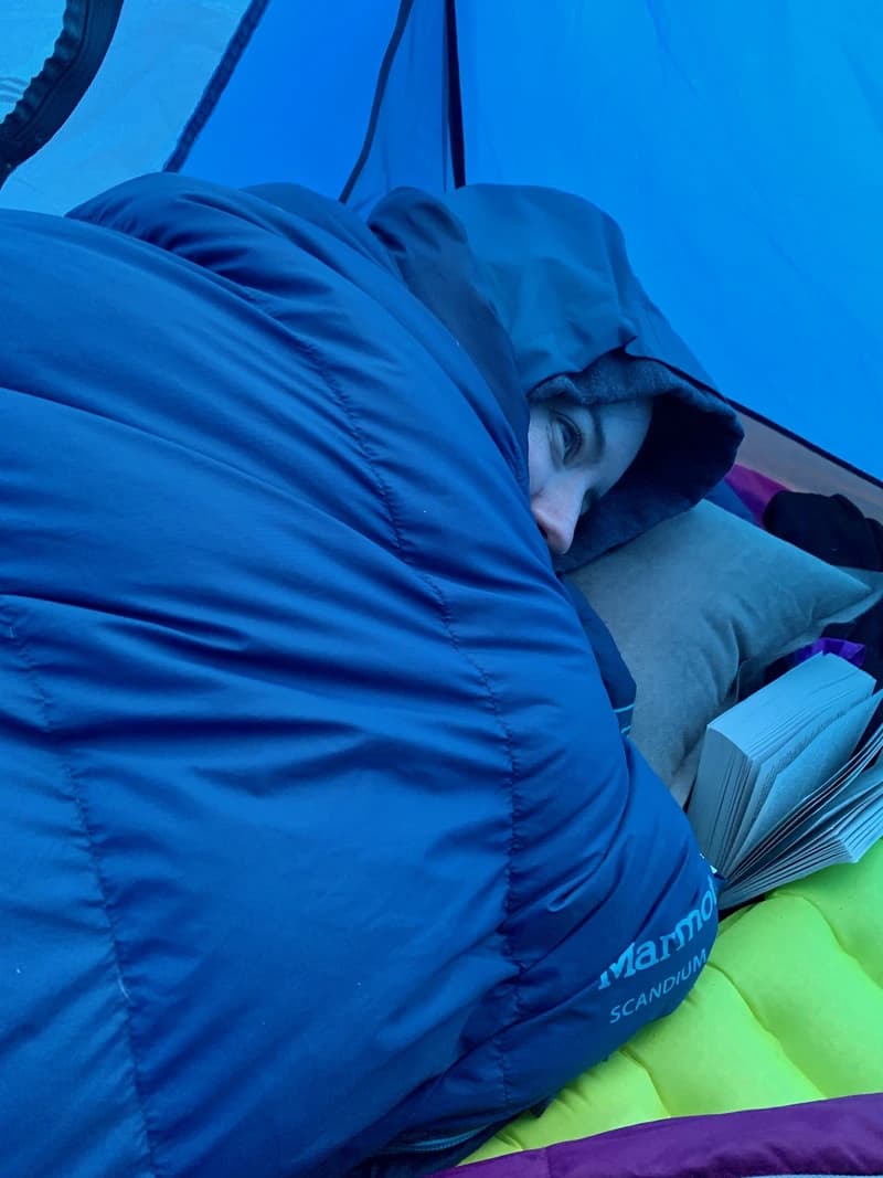 a person bundled up in a sleeping bag