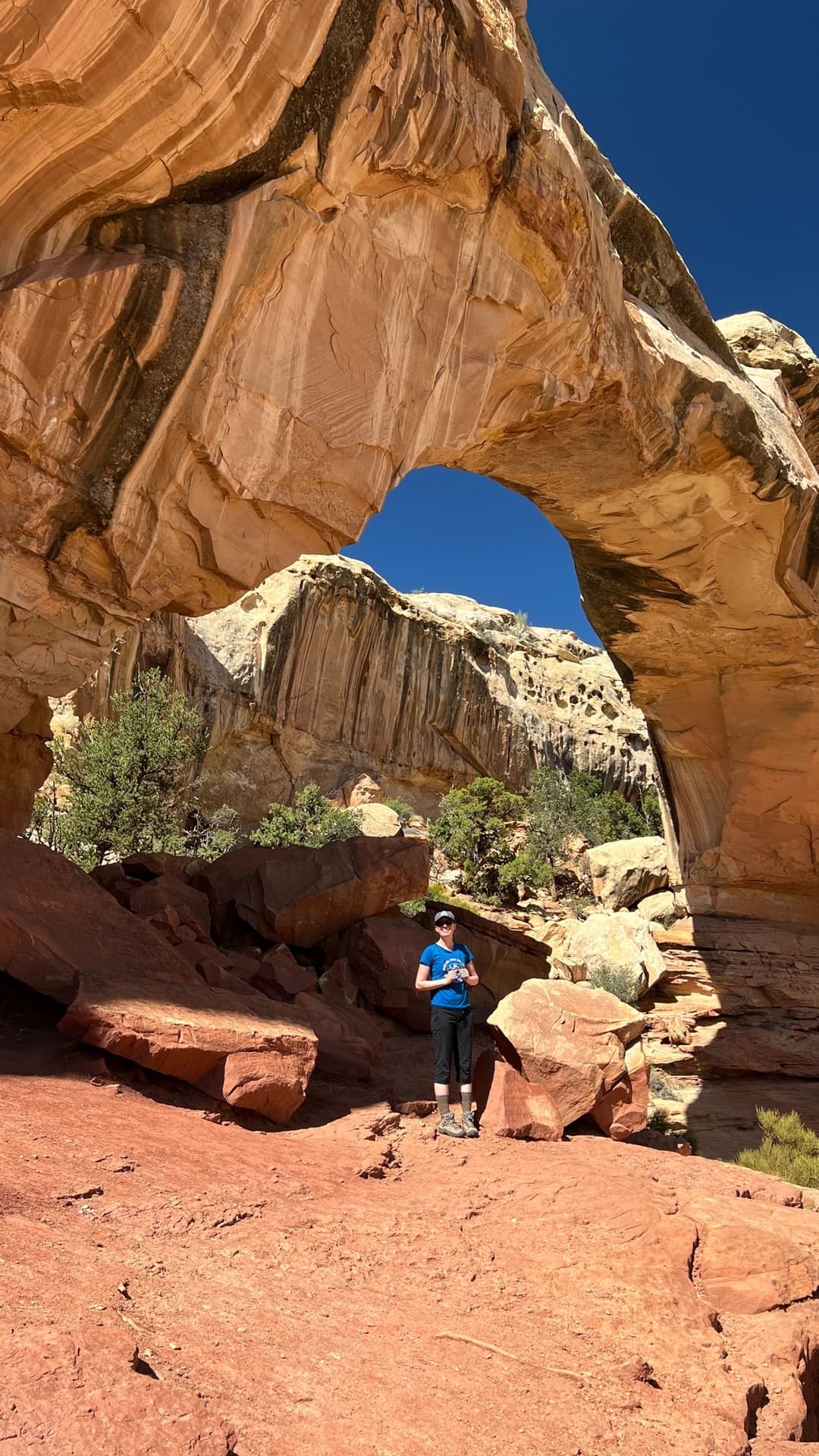 hickman natural bridge arch with a woman underneath