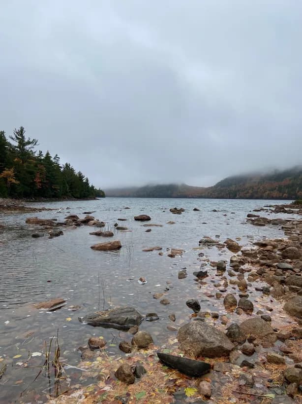 a gloomy look at the jordan pond on a cloudy day