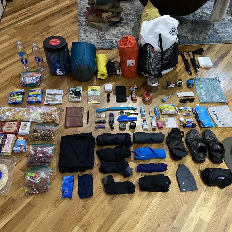 a collection of gear for a backpacking pack