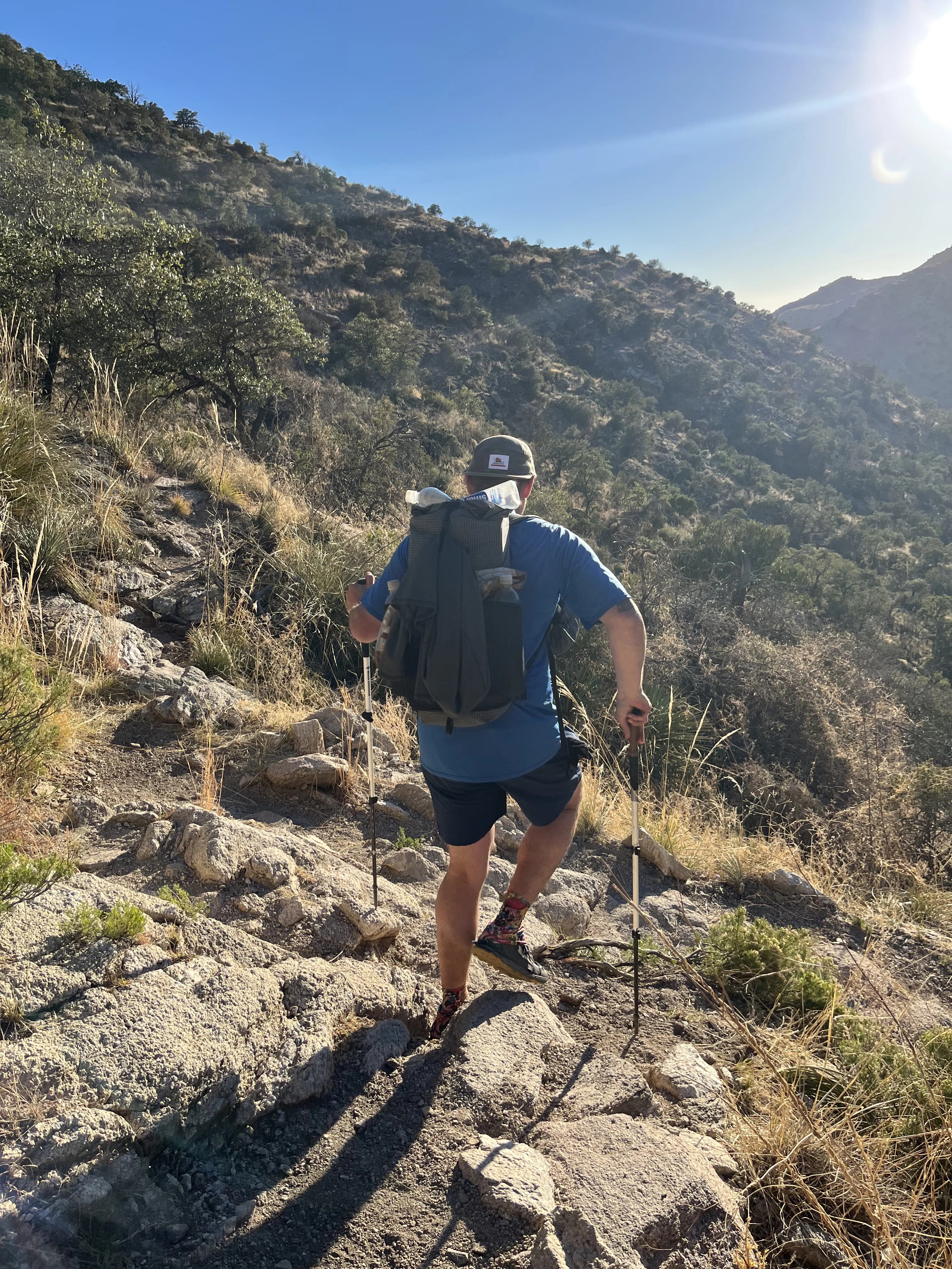 person hiking with a lightweight backpack