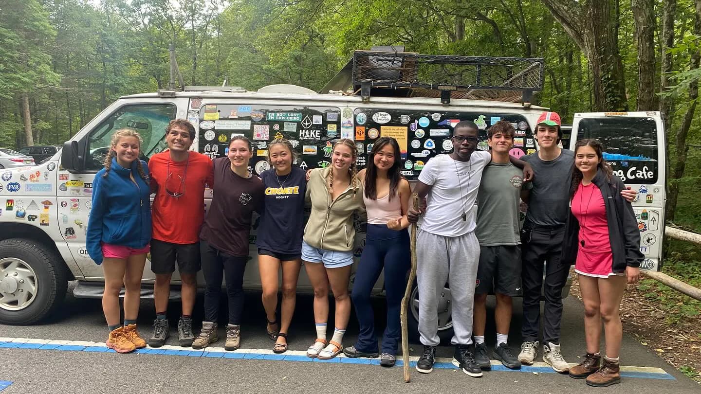 Tim Davis with a group photo by his van